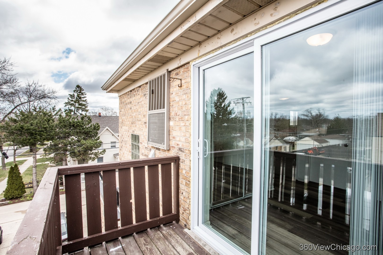 7459 North Waukegan Road, Unit 3 Niles, IL 60714 - Photo 15 of 17 a view of a balcony with wooden floor