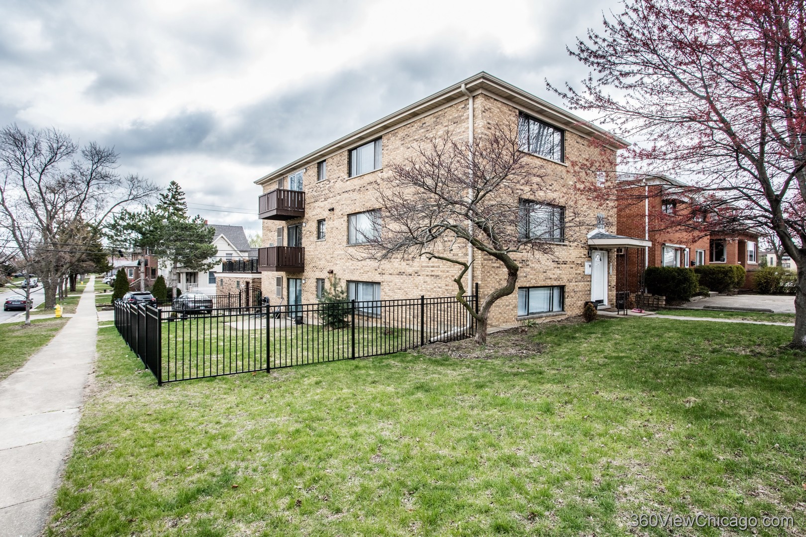7459 North Waukegan Road, Unit 3 Niles, IL 60714 - Photo 17 of 17 a front view of a house with a yard