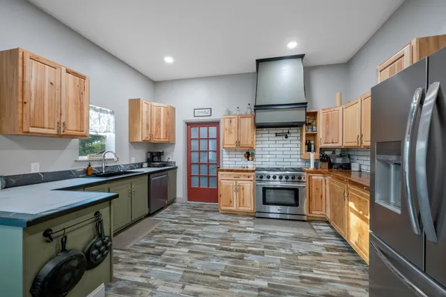 a bedroom with a bed and windows