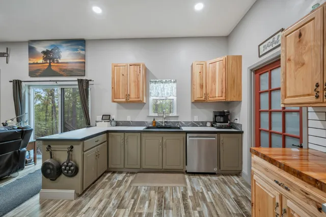a view of a workspace with furniture and a flat screen tv