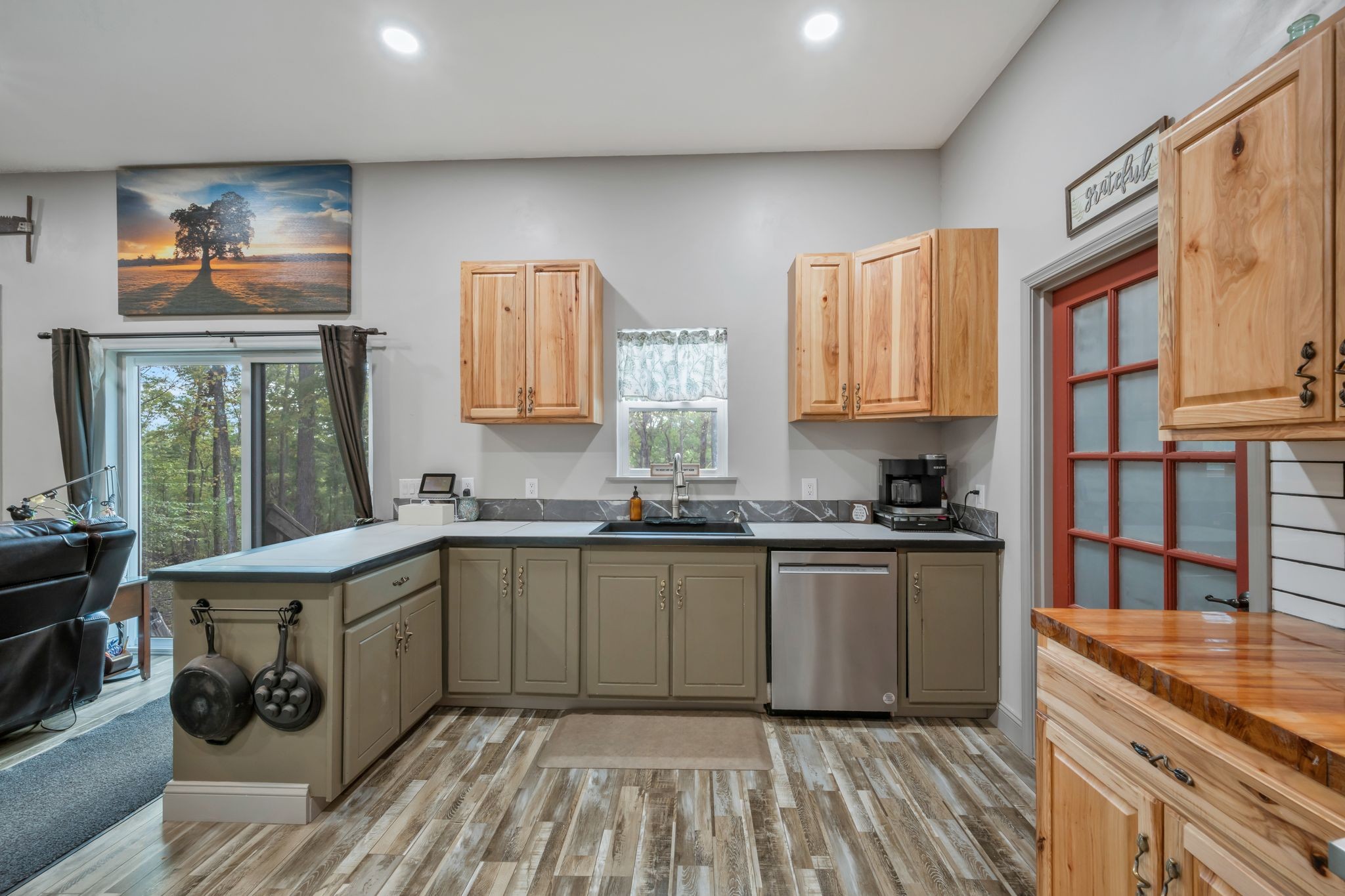 399 Coaling Road Charlotte, TN 37036 - Photo 13 of 73 a kitchen with stainless steel appliances granite countertop a sink stove and refrigerator