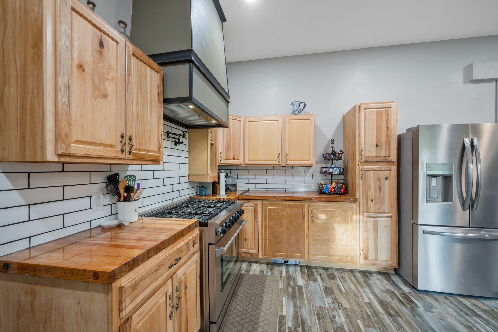 399 Coaling Road Charlotte, TN 37036 - Photo 14 of 73 a kitchen with stainless steel appliances granite countertop a refrigerator a stove and a wooden floors
