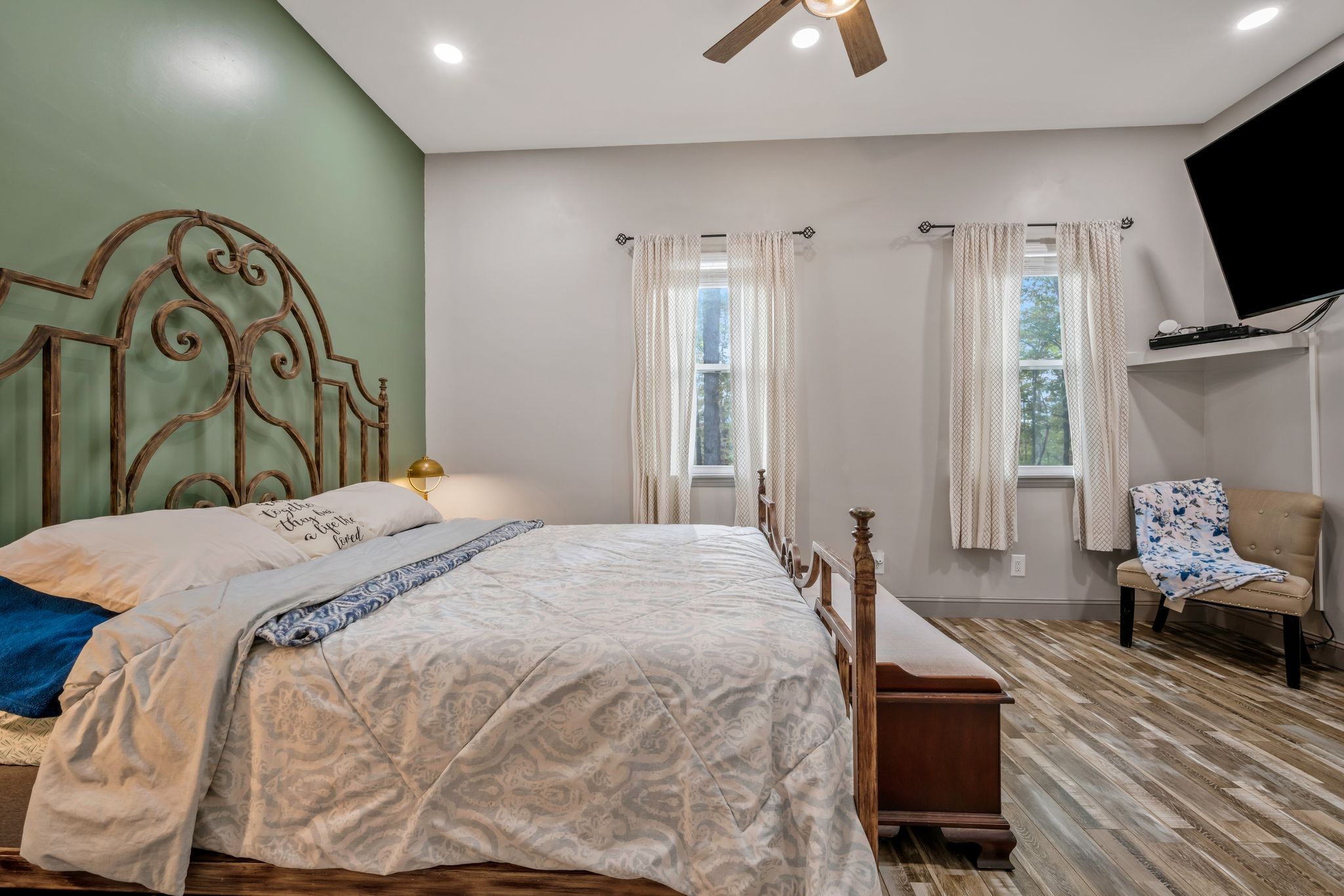 399 Coaling Road Charlotte, TN 37036 - Photo 16 of 73 a bedroom with a bed couch and a flat tv screen