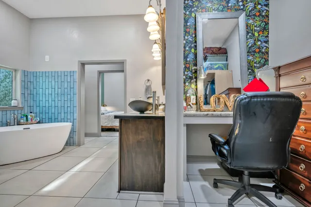 an aerial view of a house with a tree