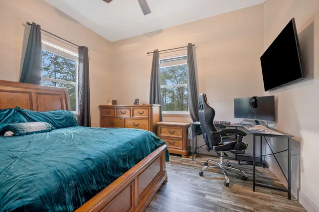 a living room with furniture a rug and a large window