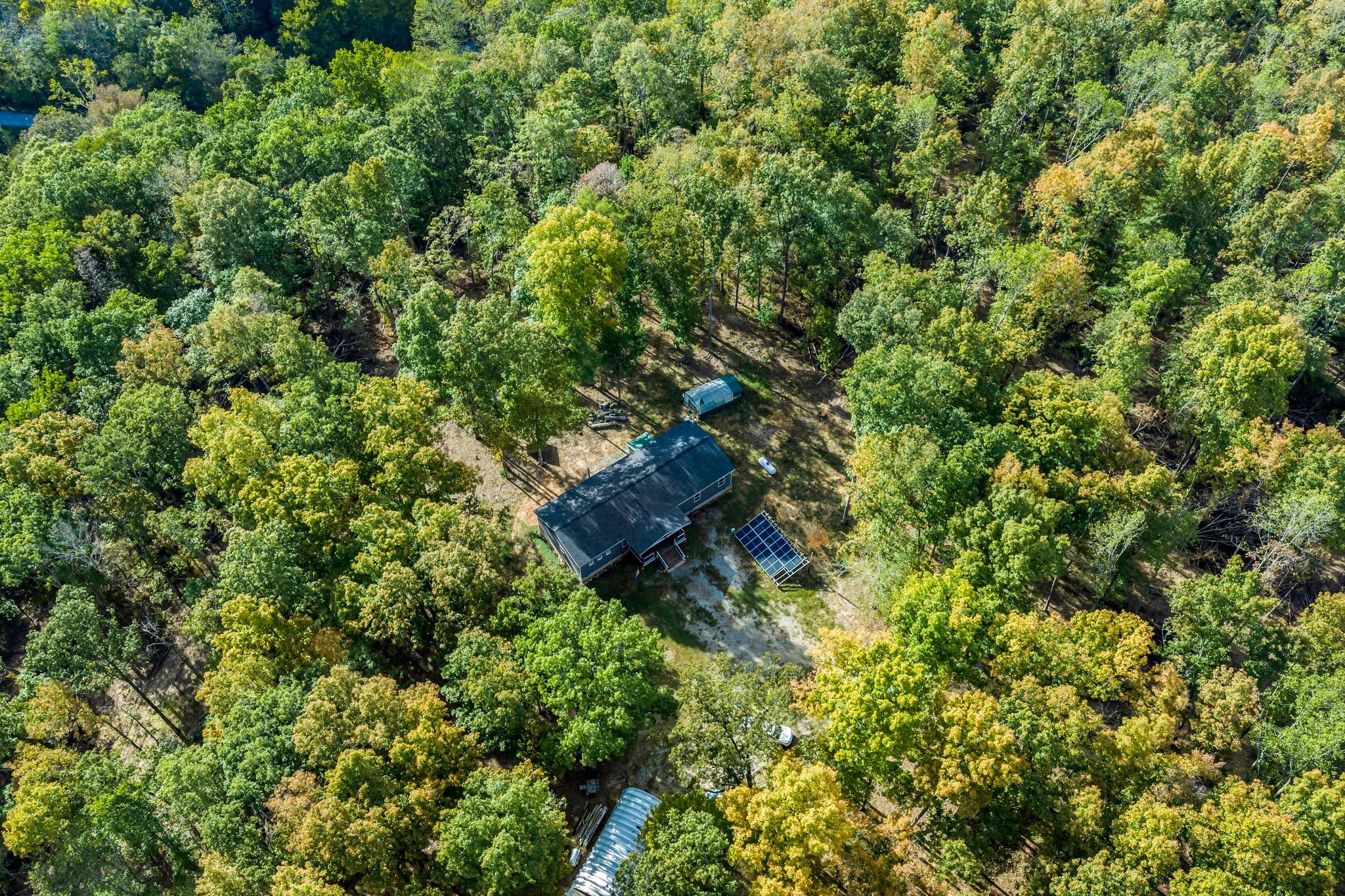 399 Coaling Road Charlotte, TN 37036 - Photo 35 of 73 an aerial view of a house with a tree