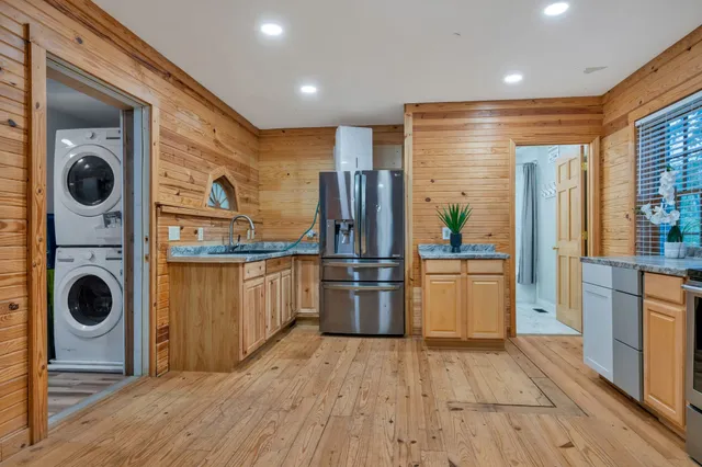 a view of a lush green forest with a tree