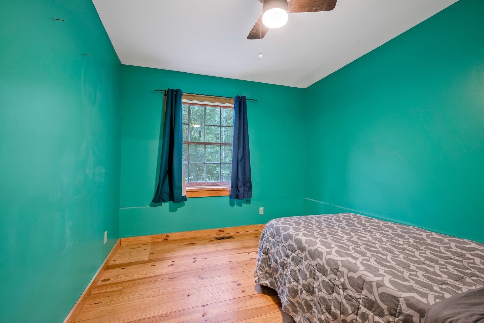 399 Coaling Road Charlotte, TN 37036 - Photo 49 of 73 a bedroom with a bed and a window