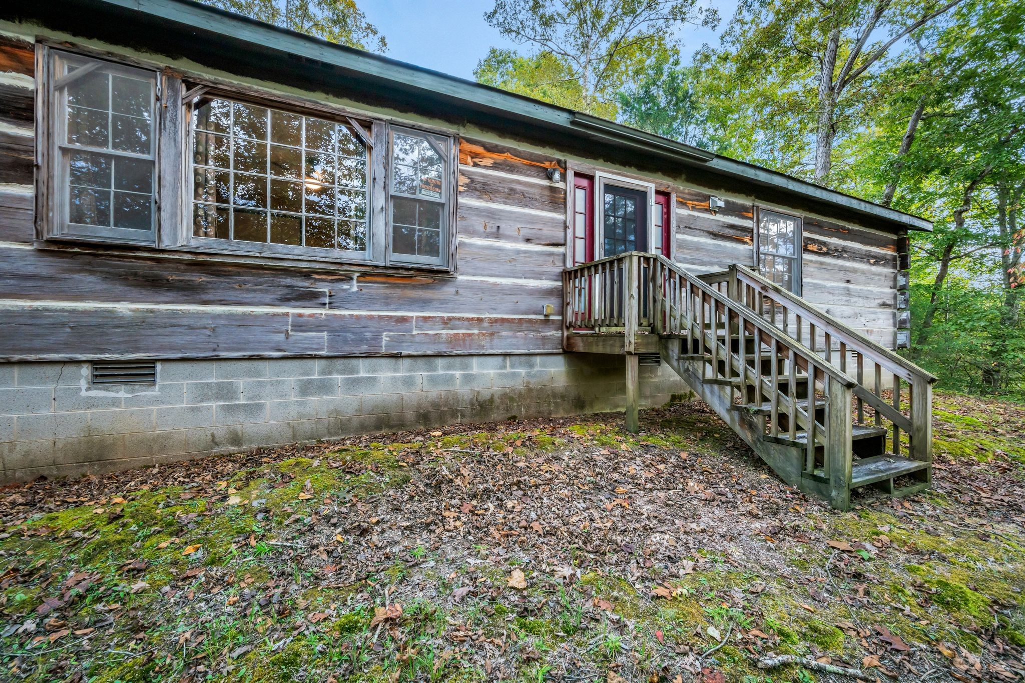 399 Coaling Road Charlotte, TN 37036 - Photo 53 of 73 a backyard of a house with lake view and a window