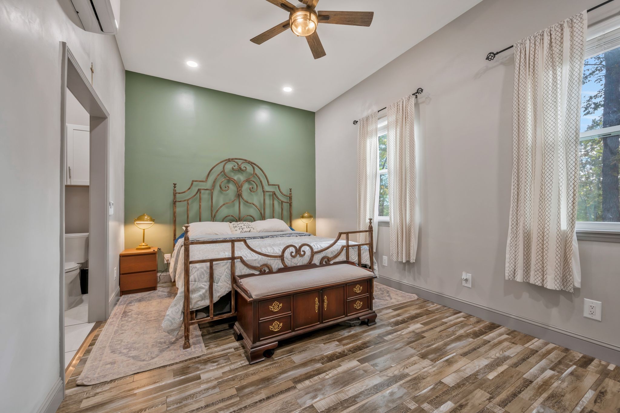 399 Coaling Road Charlotte, TN 37036 - Photo 6 of 73 a spacious bedroom with a bed and a chandelier
