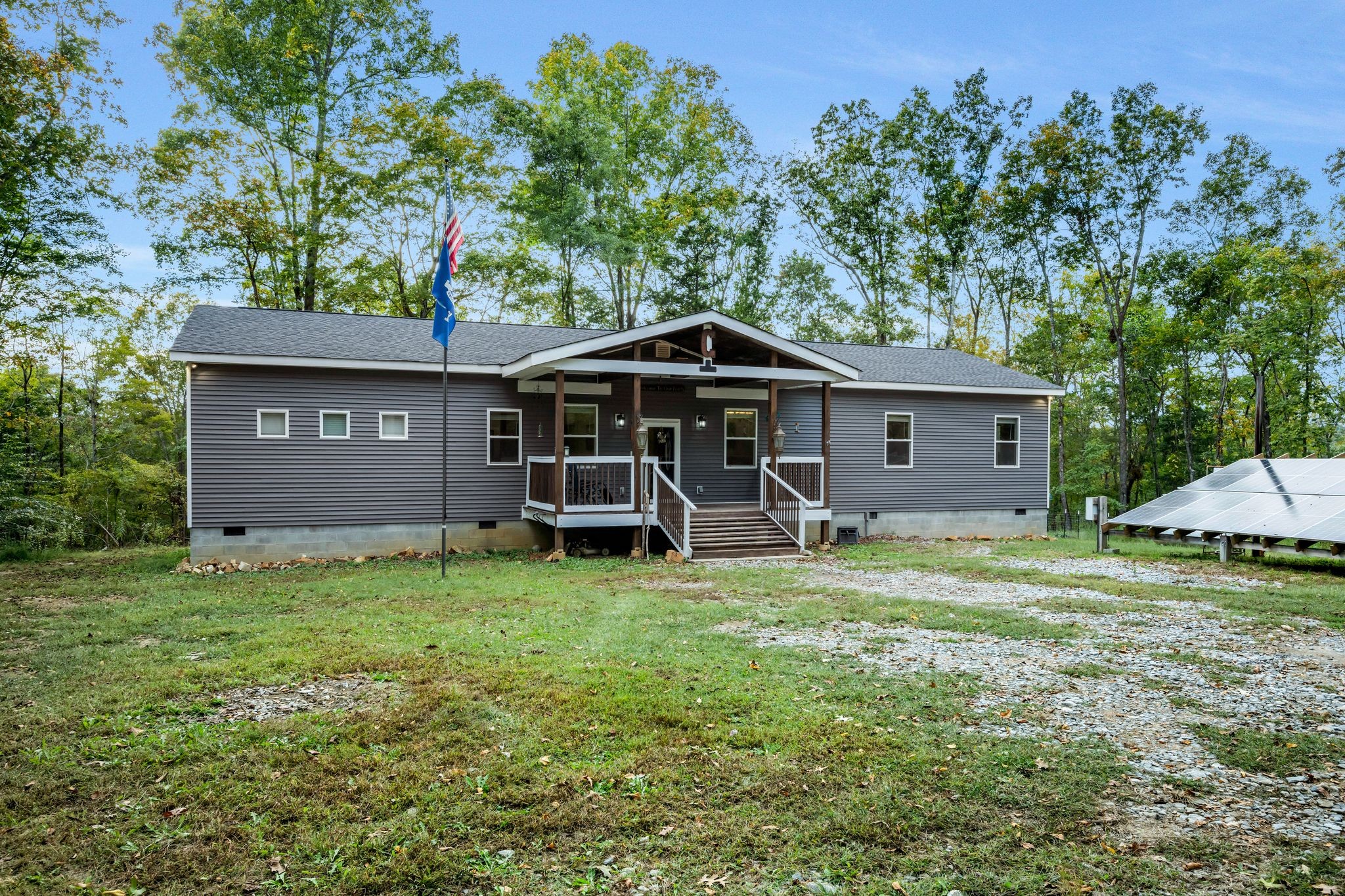 399 Coaling Road Charlotte, TN 37036 - Photo 71 of 73 a view of a house with backyard and trees