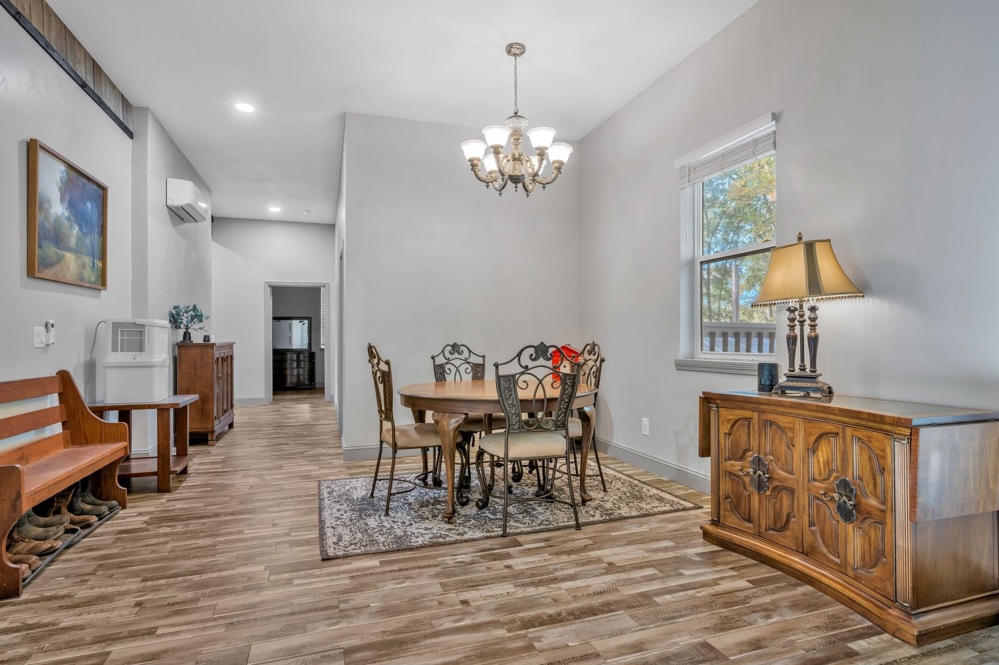 399 Coaling Road Charlotte, TN 37036 - Photo 9 of 73 a dining room with furniture a chandelier and wooden floor