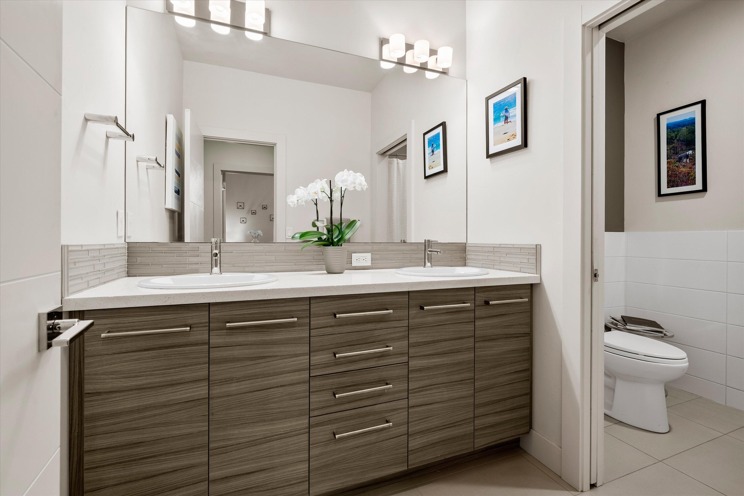 19504 Southwest Century Drive Bend, OR 97702 - Photo 35 of 58 a bathroom with a sink double vanity and a toilet