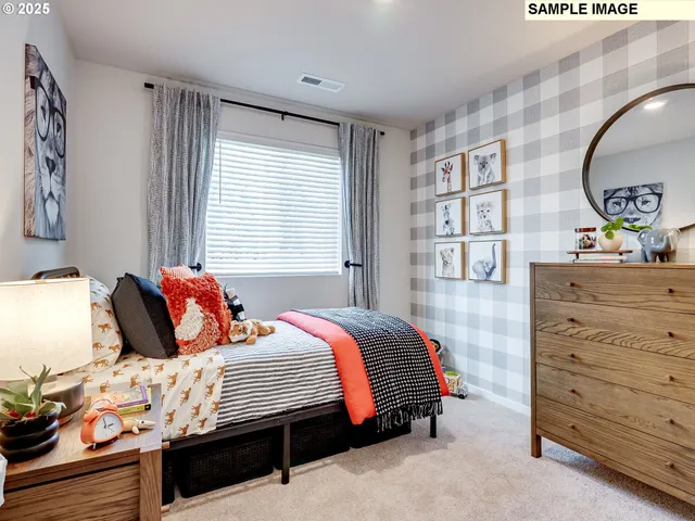 a bedroom with a bed and a dresser