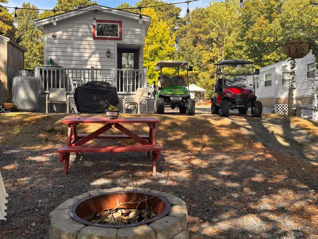 a backyard of a house with yard and outdoor seating
