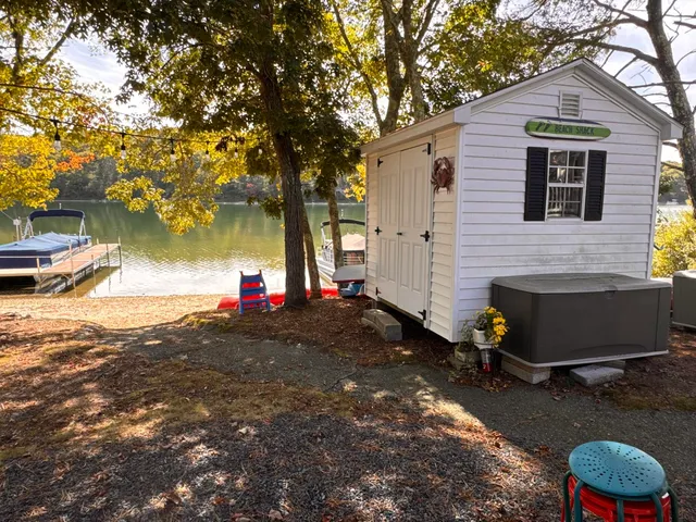 a view of a swimming pool with a yard