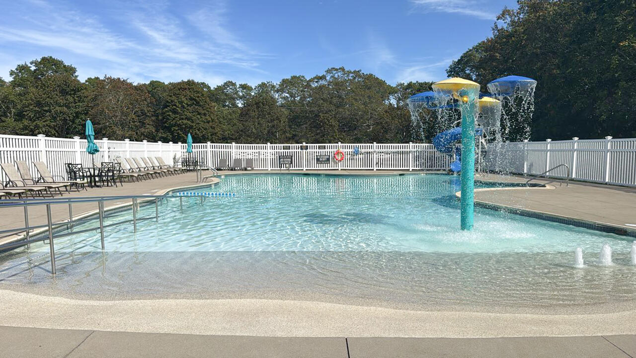185 Cotuit Road, Unit BE4 Sandwich, MA 02563 - Photo 18 of 29 a view of a swimming pool with a yard