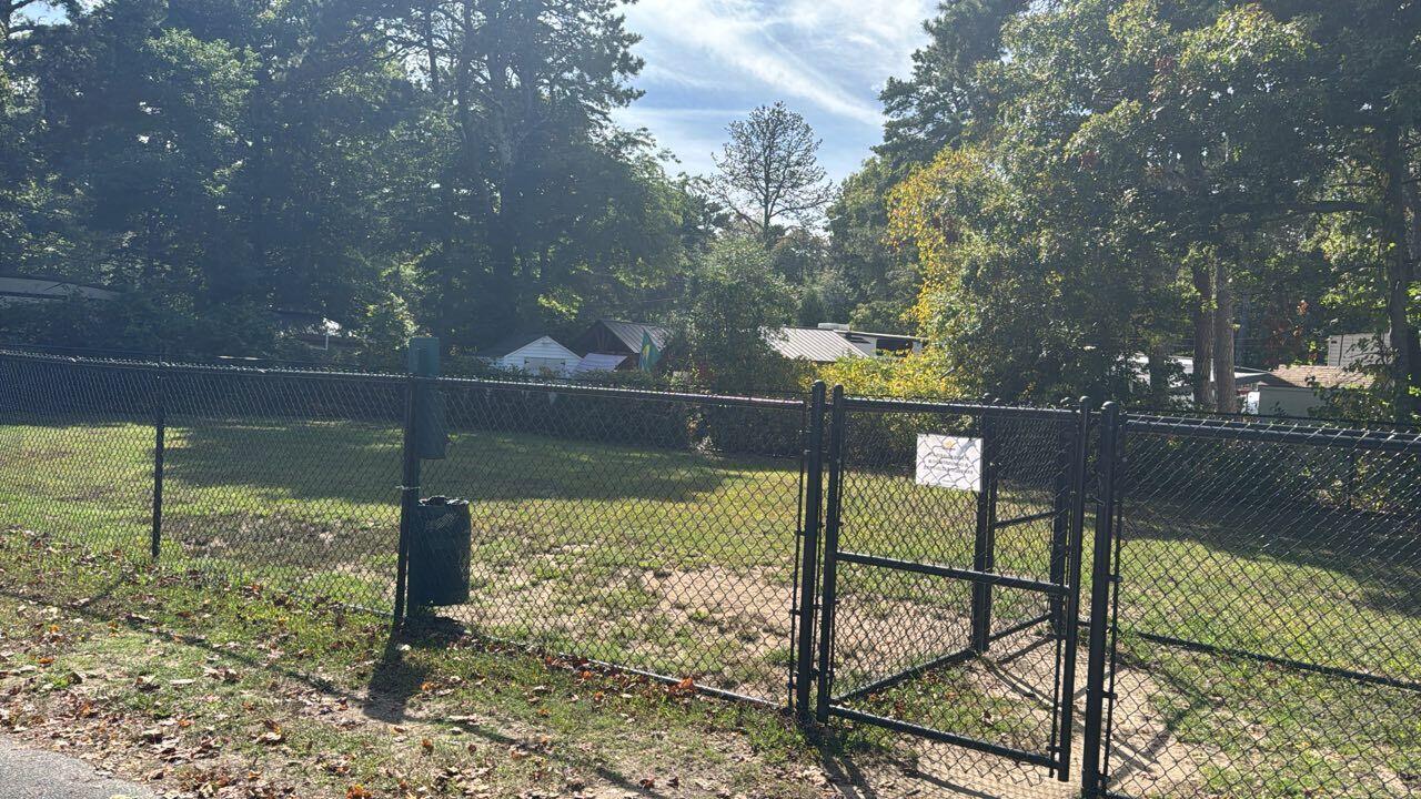 185 Cotuit Road, Unit BE4 Sandwich, MA 02563 - Photo 26 of 29 a view of a lake from a yard