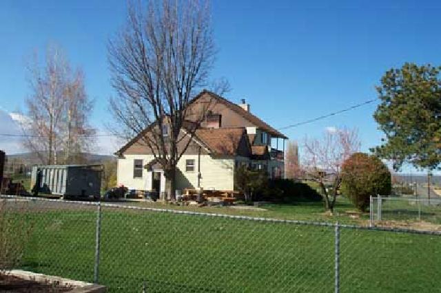 1706 Stein Road Yakima, WA 98908 - Photo 2 of 5 a front view of a house with a yard