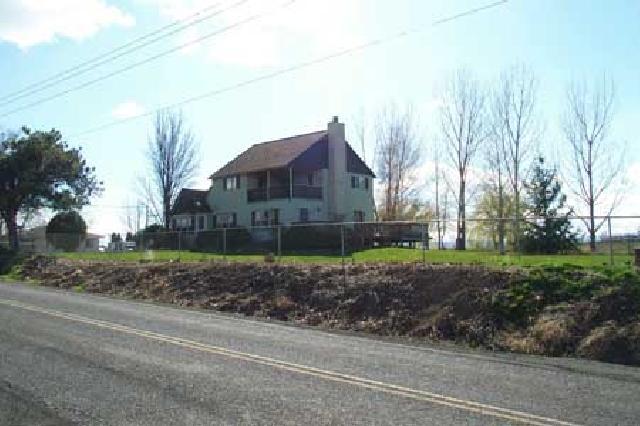 1706 Stein Road Yakima, WA 98908 - Photo 3 of 5 a front view of a house with a yard