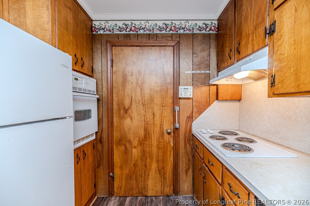 3384 Goldston Glendon Road Goldston, NC 27252 - Photo 14 of 47 a utility room with a door and a refrigerator