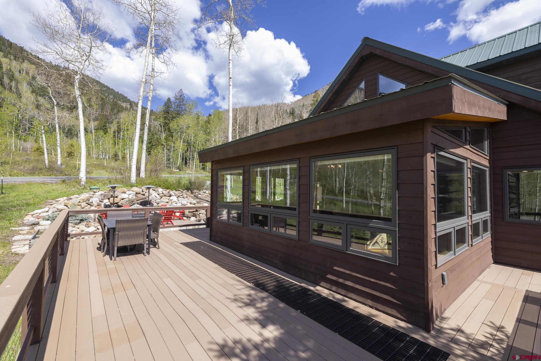 154 Falcon Ridge Road Durango, CO 81301 - Photo 5 of 42 a view of a patio with couches table and chairs