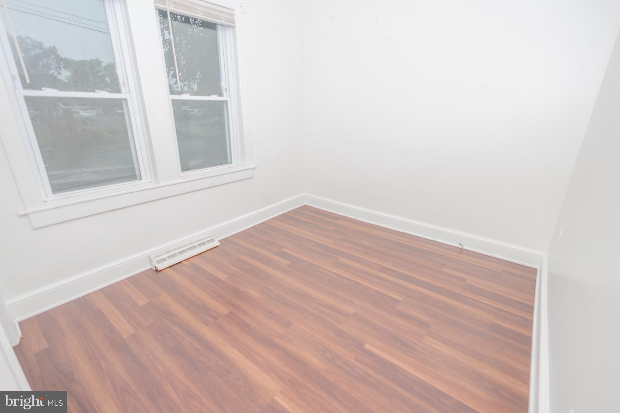 132 State Street Glassboro, NJ 08028 - Photo 13 of 19 a view of empty room with wooden floor and fan