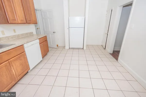 a view of an empty room and utility room
