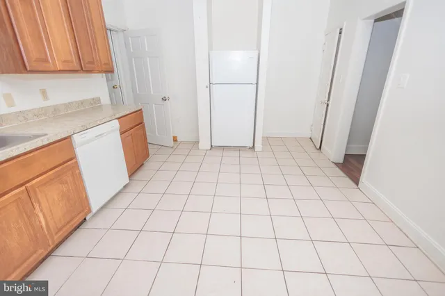 a view of an empty room and utility room