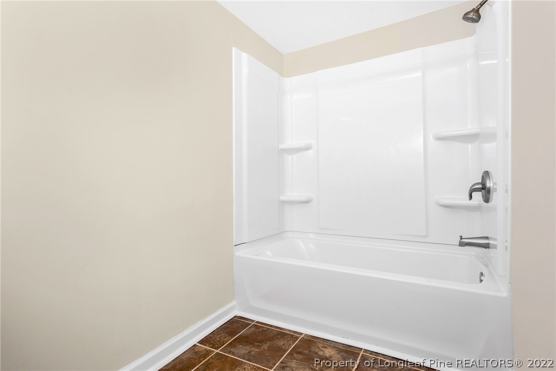 6129 Fisher Road Fayetteville, NC 28306 - Photo 23 of 31 a bathroom with a bathtub