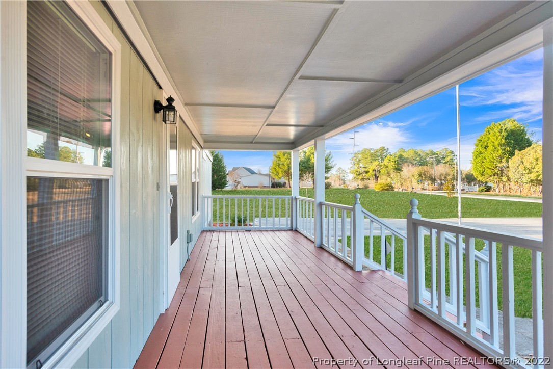 6129 Fisher Road Fayetteville, NC 28306 - Photo 4 of 31 a view of a balcony with wooden floor