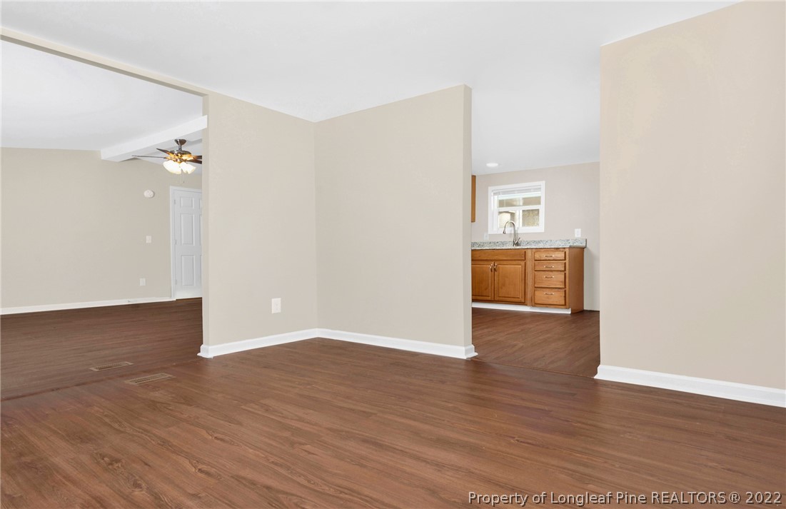 6129 Fisher Road Fayetteville, NC 28306 - Photo 9 of 31 a view of empty room with wooden floor
