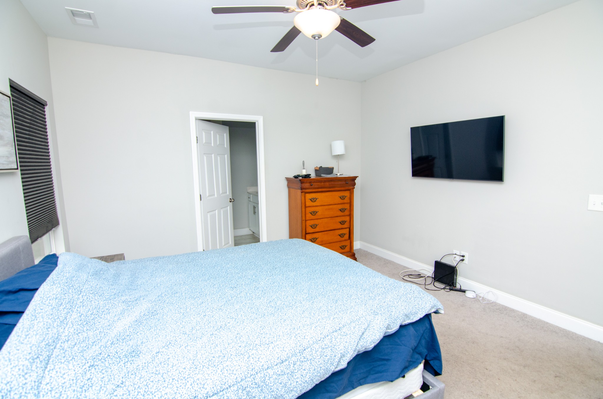 1060 Westgate Drive Gallatin, TN 37066 - Photo 14 of 31 a bedroom with a bed and a flat screen tv