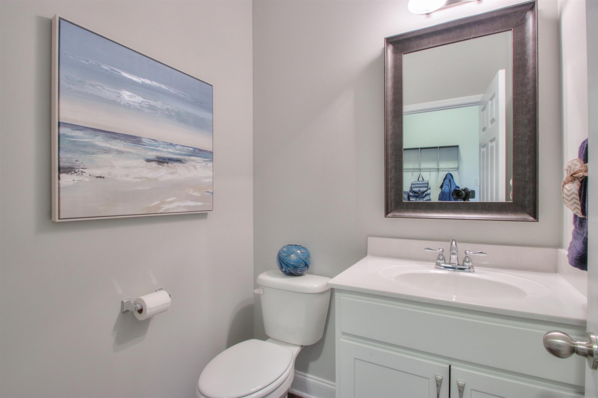 1060 Westgate Drive Gallatin, TN 37066 - Photo 18 of 31 a bathroom with a toilet sink and mirror