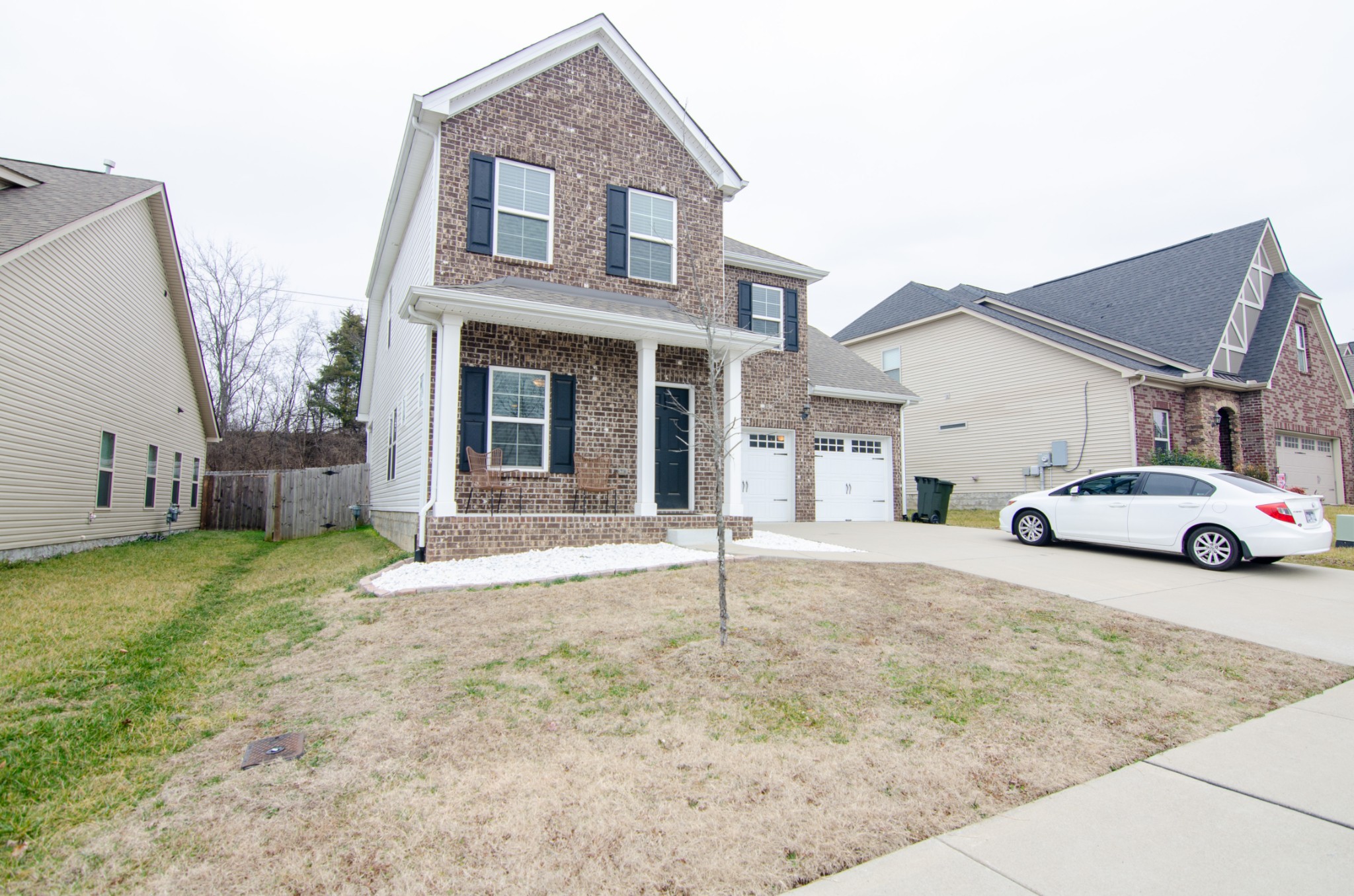 1060 Westgate Drive Gallatin, TN 37066 - Photo 2 of 31 a white house that has a tree in front of it