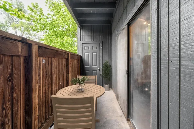 a view balcony with a table and chairs