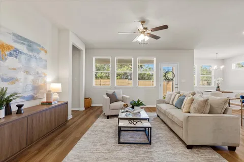 a living room with furniture and windows