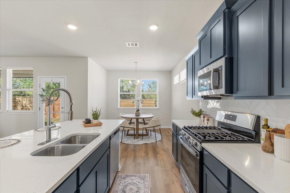 161 Spangle Way Kyle, TX 78640 - Photo 14 of 33 The kitchen effortlessly flows into the dining area.
