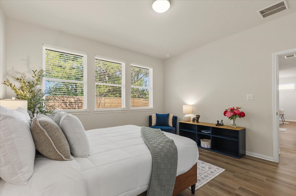 161 Spangle Way Kyle, TX 78640 - Photo 17 of 33 Three windows line the rear wall for natural light and back yard views.