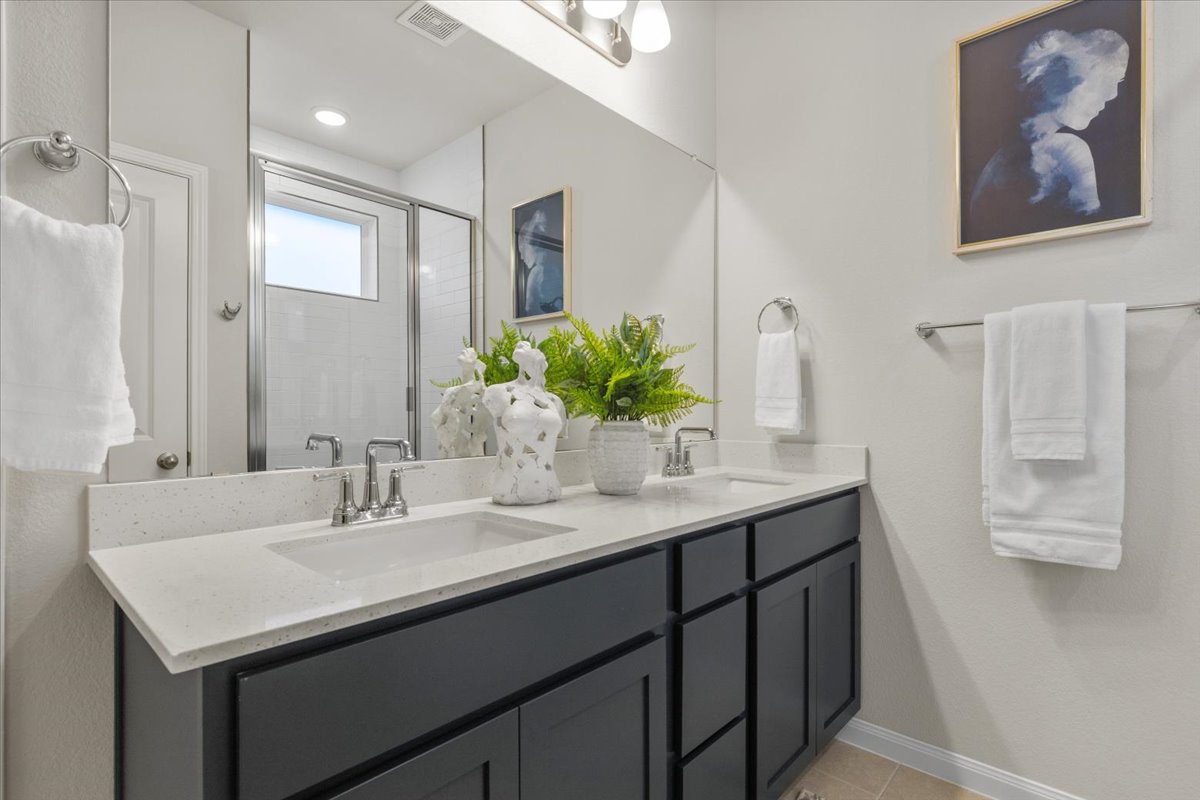 161 Spangle Way Kyle, TX 78640 - Photo 19 of 33 The ensuite offers a dual vanity with ample storage.