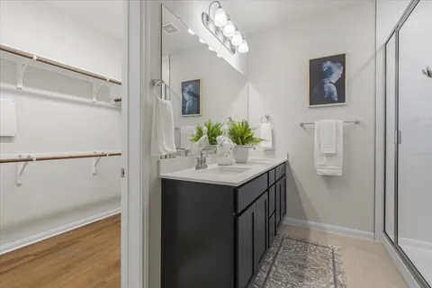 a bathroom with a glass shower door