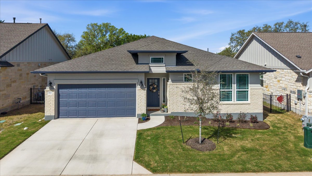 161 Spangle Way Kyle, TX 78640 - Photo 3 of 33 This single-story home is tucked away in the Anthem Cottages community, backing to wooded acreage for picturesque views.