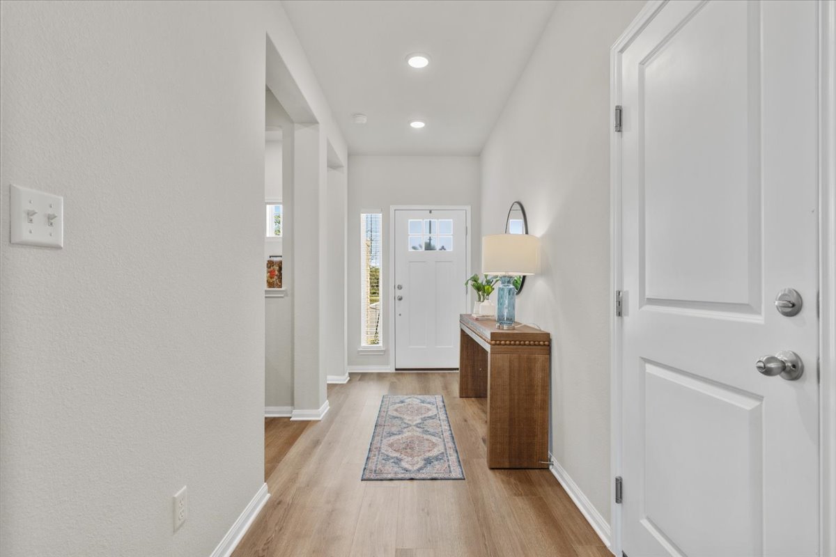 161 Spangle Way Kyle, TX 78640 - Photo 4 of 33 The entry welcomes you to a warm and neutral interior.