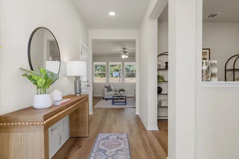 a dining room with table and chairs