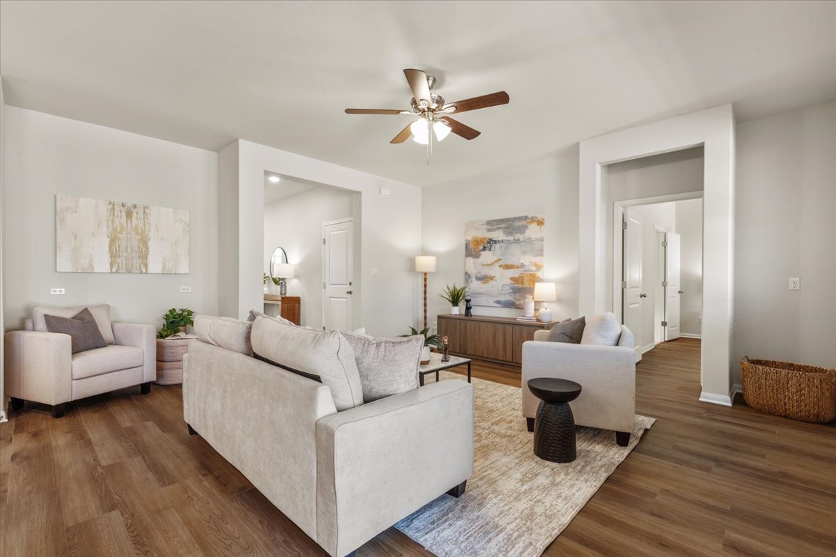 161 Spangle Way Kyle, TX 78640 - Photo 7 of 33 Low-maintenance LVP flooring in a warm, medium tone flows throughout the home.