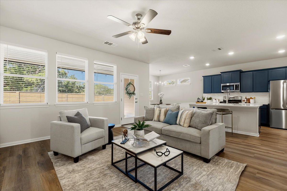 161 Spangle Way Kyle, TX 78640 - Photo 8 of 33 Windows line the rear wall of the home, taking advantage of every opportunity for a view.
