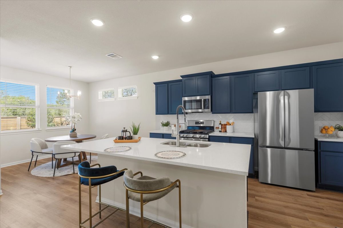 161 Spangle Way Kyle, TX 78640 - Photo 9 of 33 The kitchen takes center stage in the home.