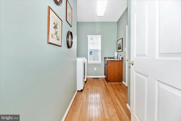 a bedroom with a bed couch and a window