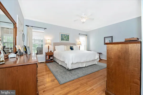 a bedroom with a bed and flat screen tv