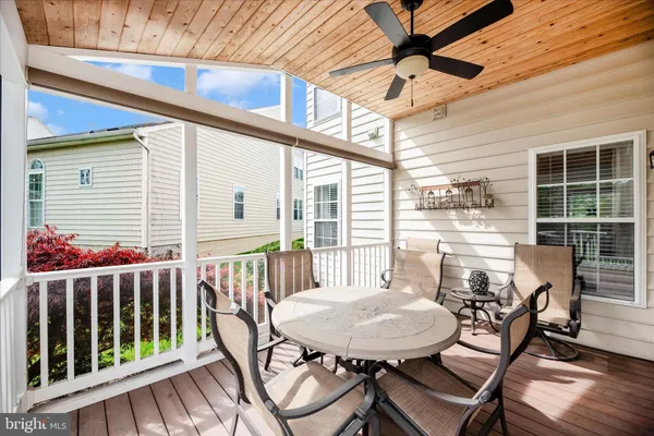 a view of house with outdoor space and seating area